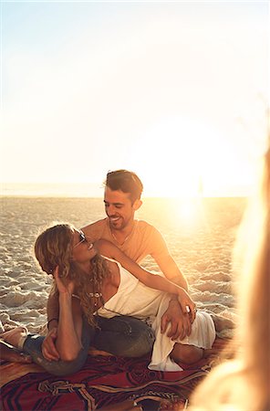 simsearch:6113-09027854,k - Affectionate young couple relaxing on sunny summer beach Stock Photo - Premium Royalty-Free, Code: 6113-09027909