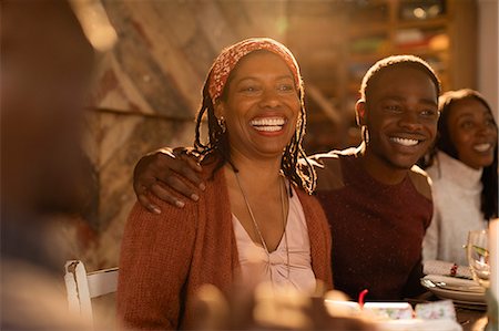 simsearch:6113-09144577,k - Portrait enthusiastic mother and son enjoying Christmas dinner with family Foto de stock - Sin royalties Premium, Código: 6113-09144580