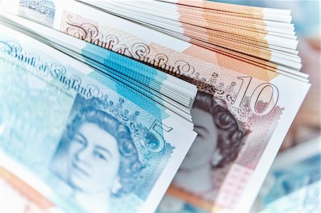 piles of cash pounds - Five and ten pound note stacks Stock Photo - Premium Royalty-Free, Code: 6113-09144737