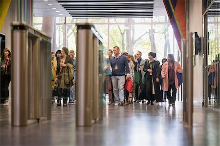 Business people arriving at conference Fotografie stock - Premium Royalty-Free, Codice: 6113-09157443