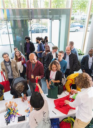 registration - Business people arriving, checking in at conference registration table Stock Photo - Premium Royalty-Free, Code: 6113-09157487