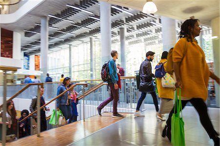 simsearch:6105-06043104,k - Business people ascending stairs at conference Stock Photo - Premium Royalty-Free, Code: 6113-09157411