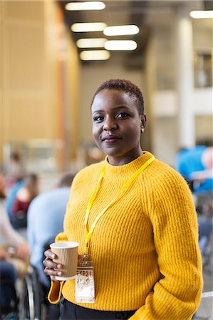 simsearch:6113-08698012,k - Portrait confident businesswoman drinking coffee at conference Foto de stock - Sin royalties Premium, Código: 6113-09157424