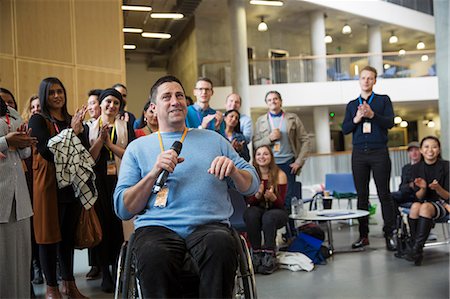 simsearch:649-09061513,k - Audience clapping for male speaker in wheelchair Stock Photo - Premium Royalty-Free, Code: 6113-09157431