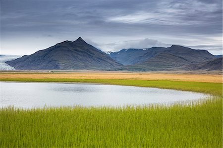 simsearch:6113-08910224,k - Tranquil, remote mountain landscape with fresh, green grass, Iceland Stock Photo - Premium Royalty-Free, Code: 6113-09157761