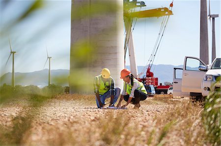 engineers meeting full body - Engineers reviewing plans at turbine power plant Stock Photo - Premium Royalty-Free, Code: 6113-09157775