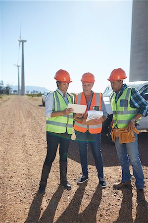 environmental issues for computers - Engineer and workers using digital tablet at wind turbine power plant Stock Photo - Premium Royalty-Free, Code: 6113-09157785