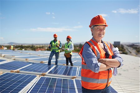 sustainable resource - Portrait confident female engineer at sunny solar power plant Stock Photo - Premium Royalty-Free, Code: 6113-09157823