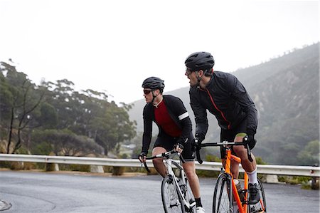 simsearch:695-03378165,k - Male cyclists cycling on road Stock Photo - Premium Royalty-Free, Code: 6113-09157939