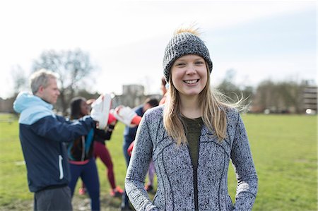 simsearch:649-05648783,k - Portrait smiling, confident woman boxing with friends in park Stock Photo - Premium Royalty-Free, Code: 6113-09160098