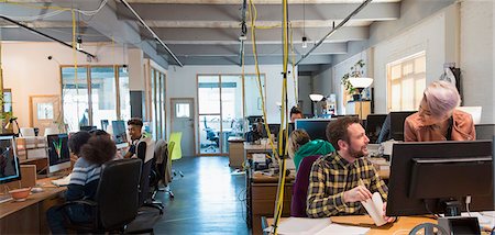 people eating at work - Creative business people working in open plan office Photographie de stock - Premium Libres de Droits, Code: 6113-09160015