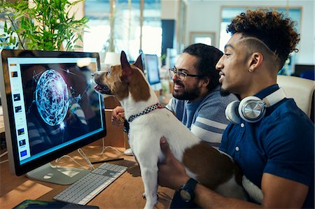 pet owner (male) - Graphic designers with dog working at computer in office Stock Photo - Premium Royalty-Free, Code: 6113-09160034