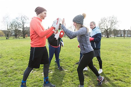 fitness class instructor - People boxing in park Stock Photo - Premium Royalty-Free, Code: 6113-09160153