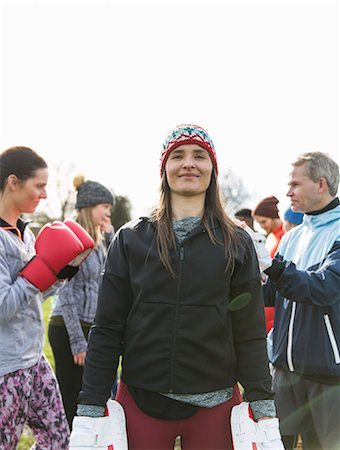 Portrait confident woman boxing in park Stock Photo - Premium Royalty-Free, Code: 6113-09160165