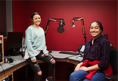 radio studio - Portrait confident teenage girl musicians recording music in sound booth Stock Photo - Premium Royalty-Free, Code: 6113-09168292