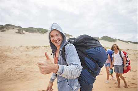 parachute, beach - Portrait confident man with paragliding parachute backpack on beach Photographie de stock - Premium Libres de Droits, Code: 6113-09168440