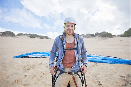 parachute, beach - Portrait confident male paraglider on beach Photographie de stock - Premium Libres de Droits, Code: 6113-09168467