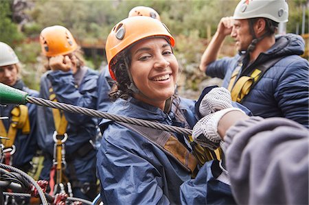 simsearch:6113-09168548,k - Portrait smiling woman zip lining Stock Photo - Premium Royalty-Free, Code: 6113-09168508