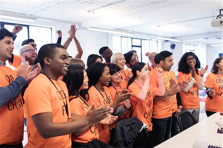 Happy hackers cheering and celebrating, coding for charity at hackathon Foto de stock - Sin royalties Premium, Código: 6113-09168657