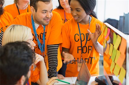 fund-raising - Hackers coding for charity at hackathon Fotografie stock - Premium Royalty-Free, Codice: 6113-09168687