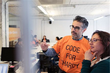 simsearch:6113-09168615,k - Hackers planning, coding for charity at hackathon Stock Photo - Premium Royalty-Free, Code: 6113-09168637