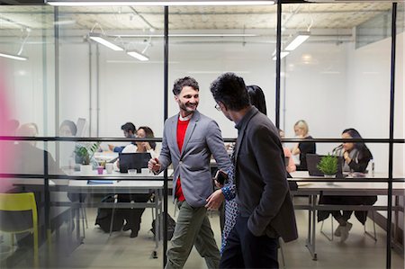 simsearch:6113-09058702,k - Business people walking and talking in office Stock Photo - Premium Royalty-Free, Code: 6113-09168794