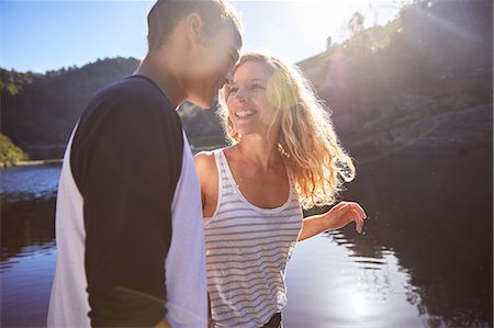 simsearch:6113-07147416,k - Affectionate, carefree couple at sunny summer lake Stock Photo - Premium Royalty-Free, Code: 6113-09168831