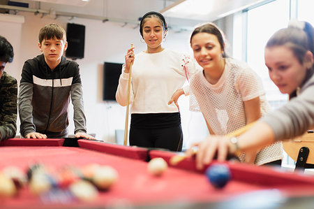 Teenagers playing pool Stock Photo - Premium Royalty-Free, Code: 6113-09178570