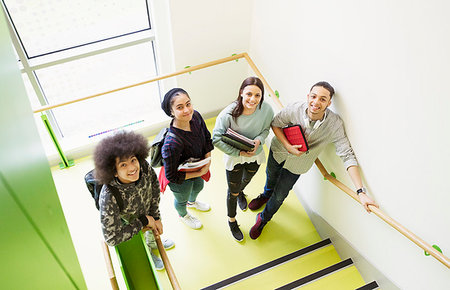 simsearch:6113-07731071,k - Portrait smiling high school students on stair landing Foto de stock - Sin royalties Premium, Código: 6113-09178574