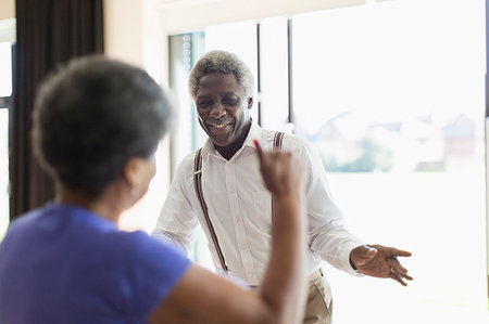 Playful senior couple dancing Stock Photo - Premium Royalty-Free, Code: 6113-09178652