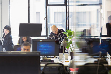 focus group - Business people working in open plan office Stock Photo - Premium Royalty-Free, Code: 6113-09178675