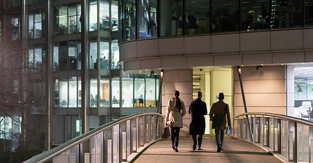 elevated pedestrian walkways - Business people walking on urban pedestrian bridge at night Stock Photo - Premium Royalty-Free, Code: 6113-09178768