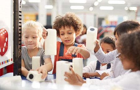 Kids playing with large dice in science center Stock Photo - Premium Royalty-Free, Code: 6113-09178964