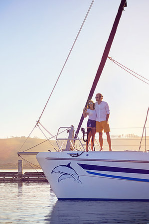 simsearch:6113-09179043,k - Couple hugging on catamaran Stock Photo - Premium Royalty-Free, Code: 6113-09178976