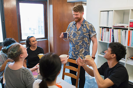 Creative business people enjoying coffee and tea in office Stock Photo - Premium Royalty-Free, Code: 6113-09179095