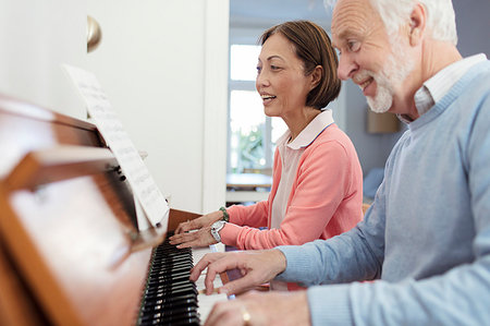 senior woman piano - Active senior couple playing piano Stock Photo - Premium Royalty-Free, Code: 6113-09192032