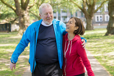simsearch:6113-09157588,k - Affectionate active senior couple walking in park Stock Photo - Premium Royalty-Free, Code: 6113-09199865