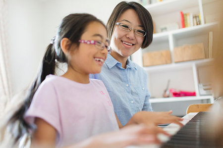 Mother and daughter playing piano Stock Photo - Premium Royalty-Free, Code: 6113-09199891