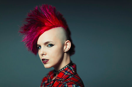 Portrait confident, cool young woman with pink mohawk Stock Photo - Premium Royalty-Free, Code: 6113-09199985