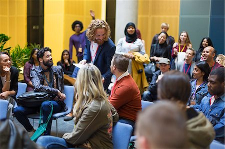 simsearch:6109-08830504,k - Audience watching speaker and man talking at conference Stock Photo - Premium Royalty-Free, Code: 6113-09131164