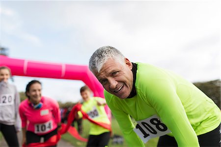 simsearch:6113-06720357,k - Portrait tired male marathon runner resting Stock Photo - Premium Royalty-Free, Code: 6113-09131183