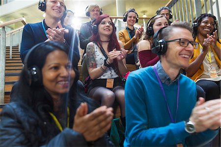 Smiling audience with headphones clapping at conference Stockbilder - Premium RF Lizenzfrei, Bildnummer: 6113-09131130
