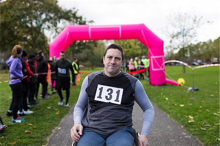 simsearch:6109-06004701,k - Portrait confident man in wheelchair at charity race Stock Photo - Premium Royalty-Free, Code: 6113-09131200