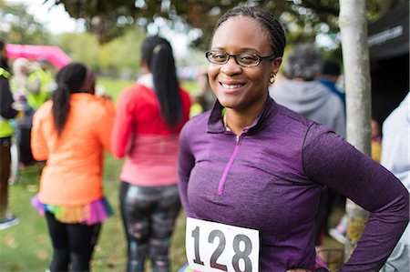simsearch:6113-07961627,k - Portrait smiling, confident female runner at charity run Photographie de stock - Premium Libres de Droits, Code: 6113-09131360
