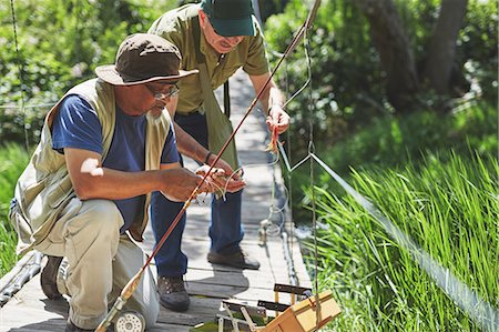 simsearch:6113-09131508,k - Active senior men friends preparing fishing line Foto de stock - Sin royalties Premium, Código: 6113-09131495