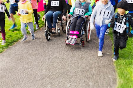 disabled asian people - People in wheelchairs and runners moving at charity race Stock Photo - Premium Royalty-Free, Code: 6113-09131437