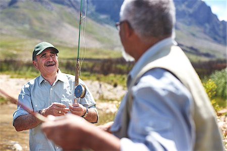 flyfishing sunlight - Smiling active senior men fishing Stock Photo - Premium Royalty-Free, Code: 6113-09131515