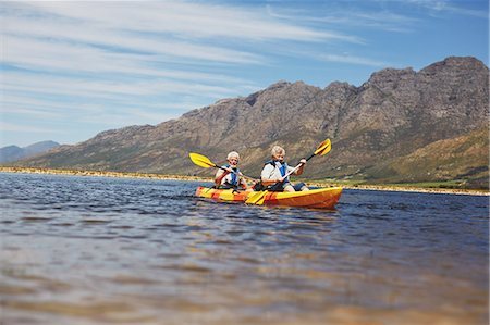 Active senior couple kayaking on sunny summer lake Stock Photo - Premium Royalty-Free, Code: 6113-09131527