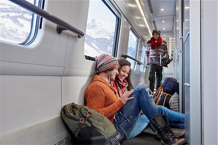 simsearch:649-03447280,k - Young couple backpacking, riding passenger train Stock Photo - Premium Royalty-Free, Code: 6113-09131604