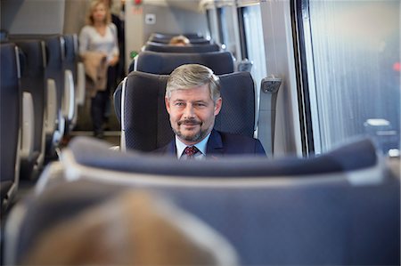 simsearch:6113-09131650,k - Confident businessman on passenger train Photographie de stock - Premium Libres de Droits, Code: 6113-09131635